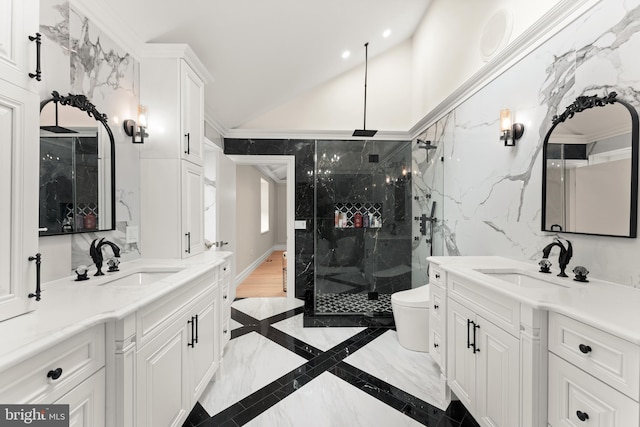 bathroom featuring a shower with door, vanity, lofted ceiling, crown molding, and toilet