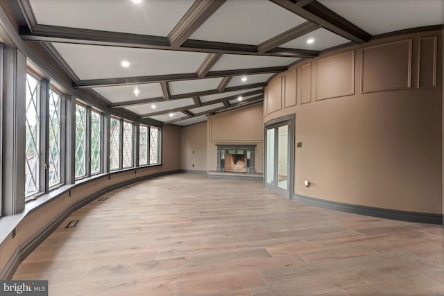 unfurnished living room with light wood-type flooring, beamed ceiling, and coffered ceiling