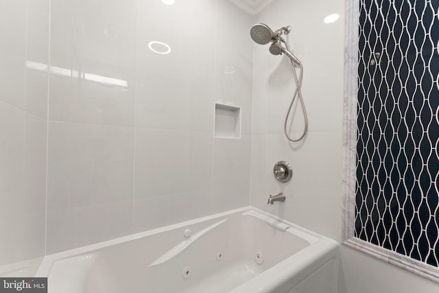 bathroom with shower / bath combo with shower curtain