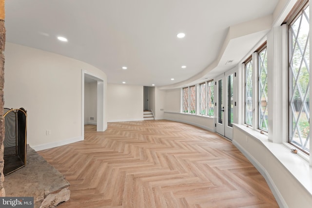 interior space featuring a healthy amount of sunlight and light parquet floors