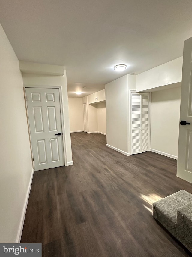 basement featuring dark wood-type flooring