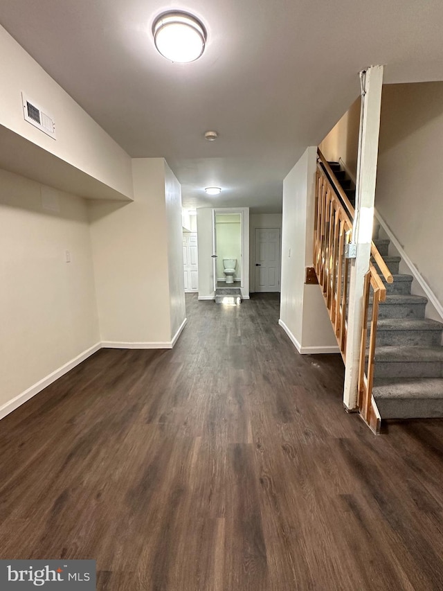 basement featuring dark hardwood / wood-style floors