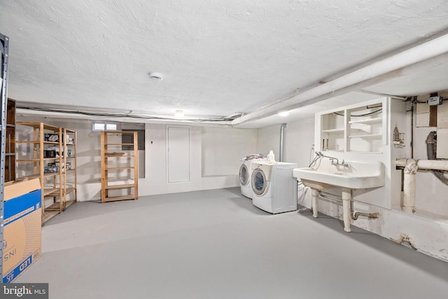 basement with washer and clothes dryer