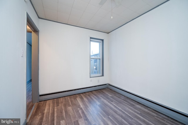 spare room featuring dark wood-type flooring