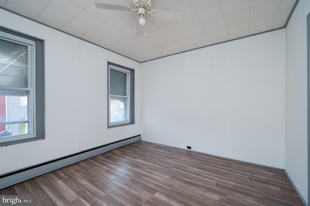 unfurnished room featuring hardwood / wood-style floors, ceiling fan, and baseboard heating