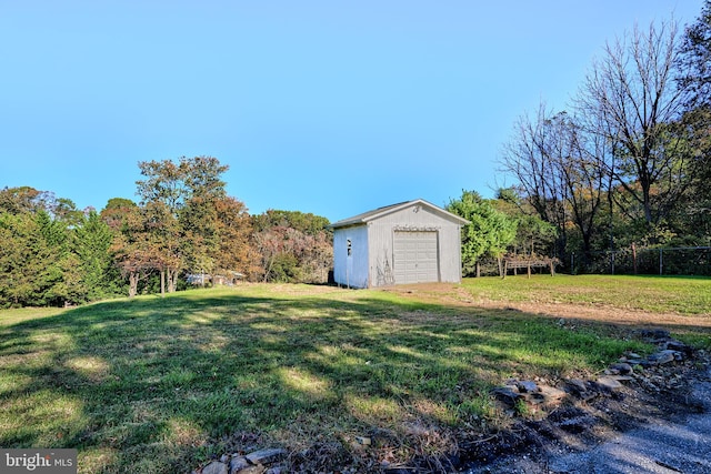 view of yard with an outbuilding and a garage