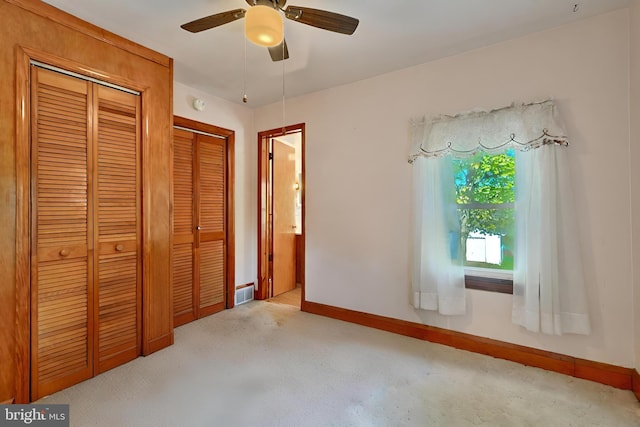 unfurnished bedroom featuring a closet and ceiling fan