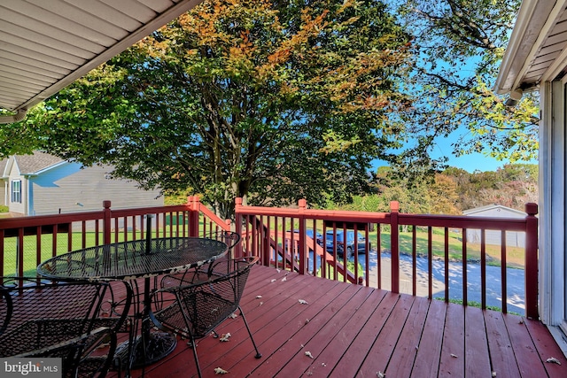 wooden deck with a yard