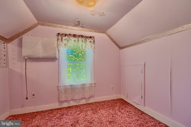 bonus room with lofted ceiling and carpet