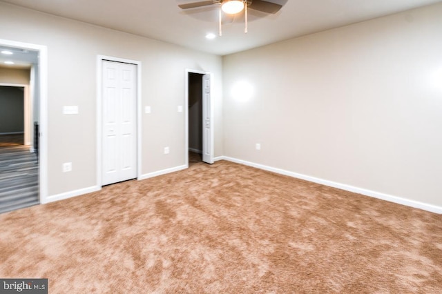 unfurnished bedroom featuring carpet flooring and ceiling fan