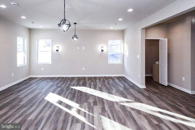 unfurnished room featuring dark hardwood / wood-style floors