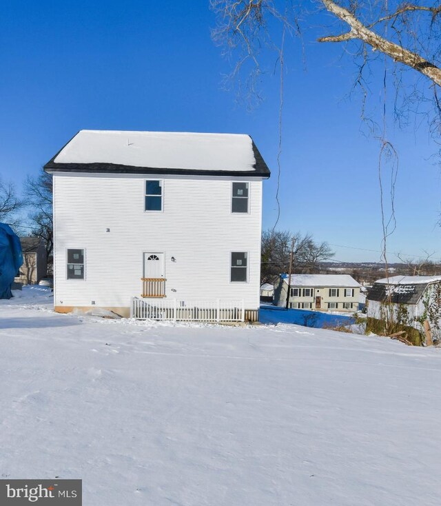 view of snow covered house