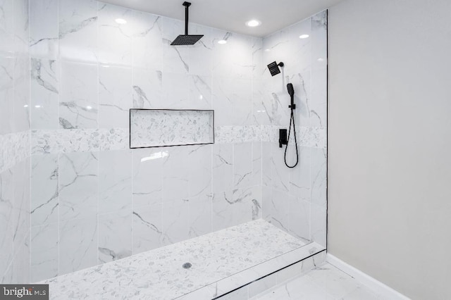 bathroom featuring tiled shower