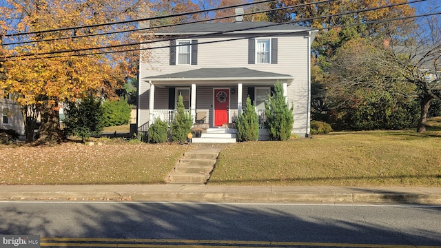 view of front of house with a front lawn and a porch