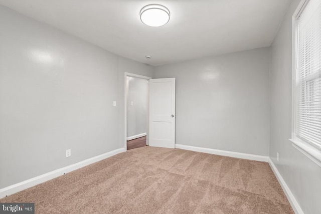 empty room featuring carpet floors