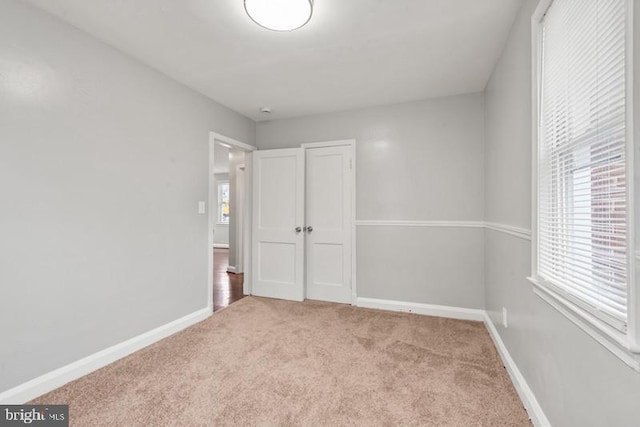 unfurnished bedroom with carpet flooring