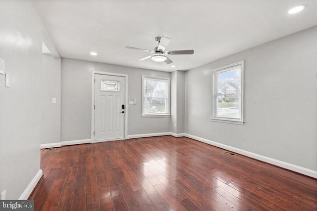 entryway with dark hardwood / wood-style floors and ceiling fan