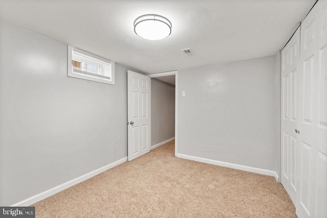 basement with light colored carpet