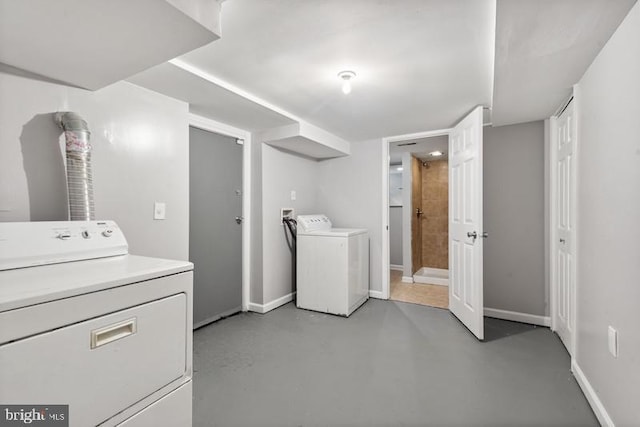 clothes washing area featuring washing machine and dryer