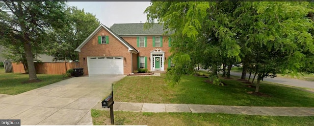 view of front facade featuring a garage and a front lawn