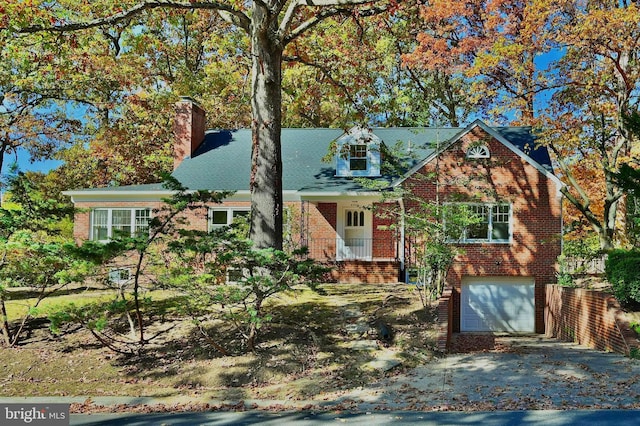 view of front of property with a porch and a garage