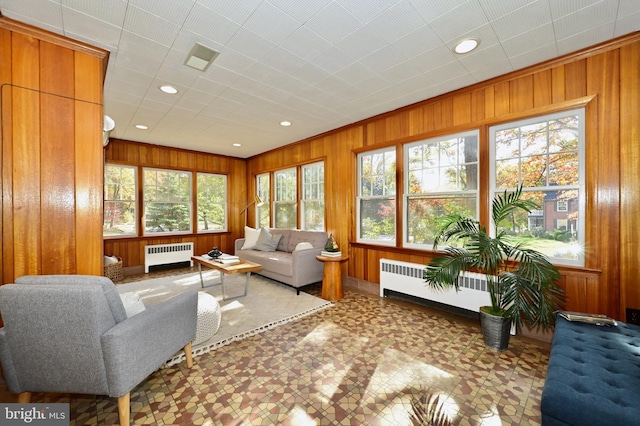 sunroom / solarium with radiator heating unit and a healthy amount of sunlight