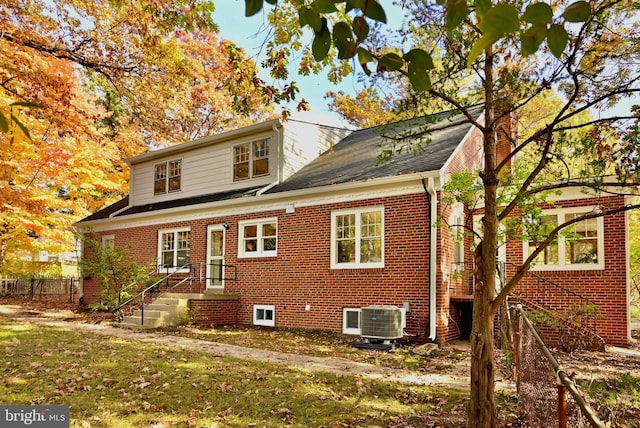 rear view of property with central air condition unit