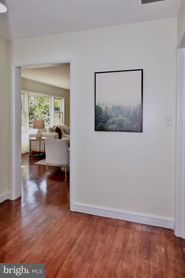 corridor featuring dark hardwood / wood-style floors