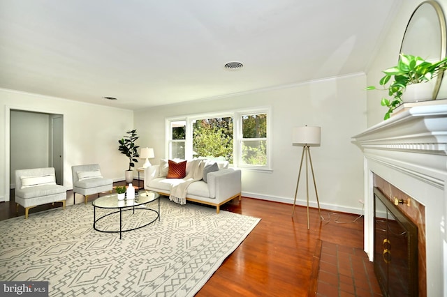 living room featuring crown molding and dark wood-type flooring