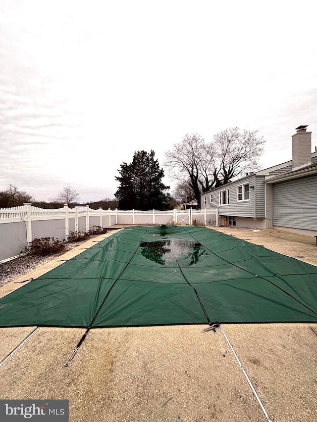 view of pool featuring a patio