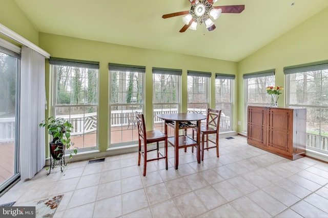 sunroom / solarium with plenty of natural light, ceiling fan, and lofted ceiling