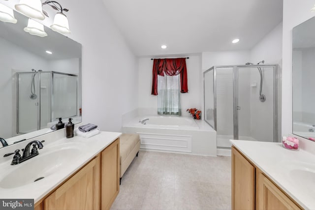 bathroom featuring plus walk in shower and vanity