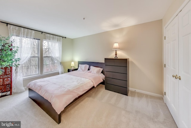 carpeted bedroom featuring a closet