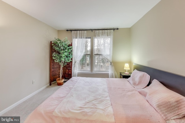 bedroom with light carpet