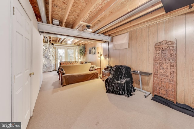 carpeted bedroom featuring wood walls and billiards