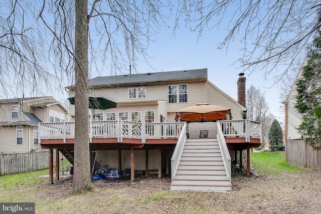 rear view of house with a wooden deck