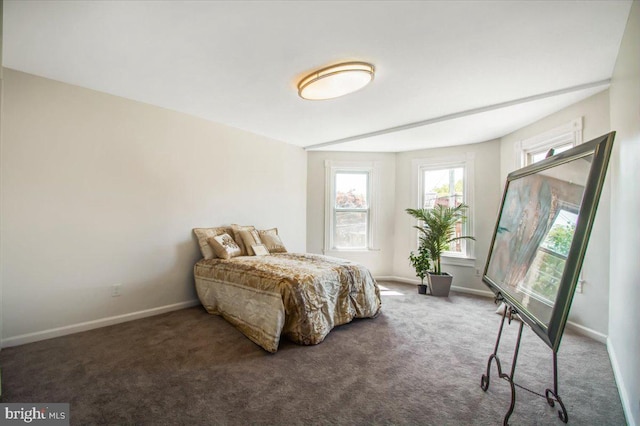 bedroom featuring dark colored carpet