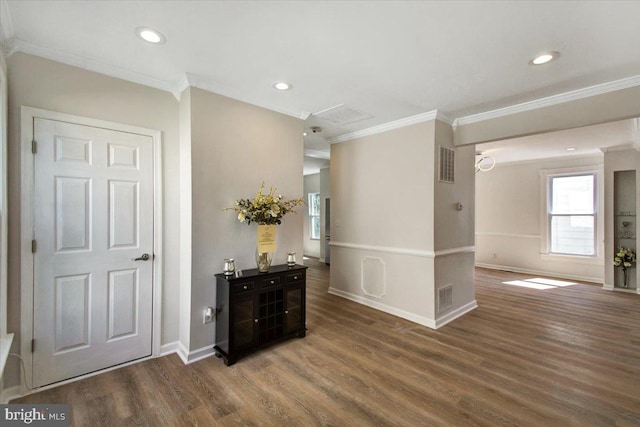 interior space with hardwood / wood-style floors and ornamental molding