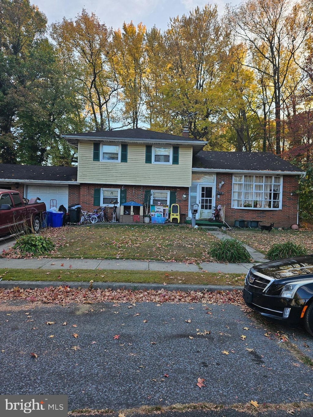 tri-level home with brick siding