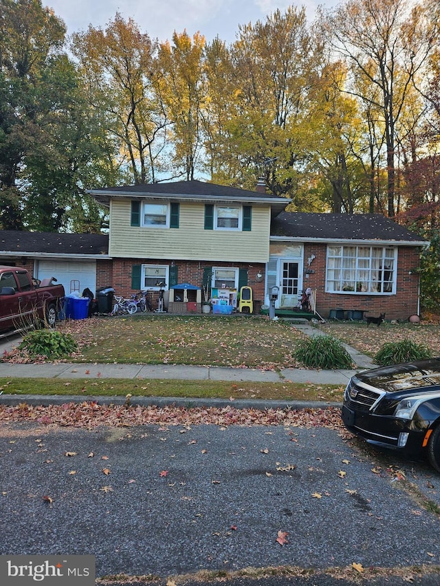 tri-level home with brick siding