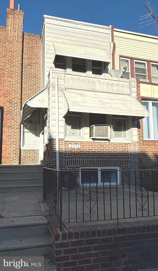 view of front facade with a balcony