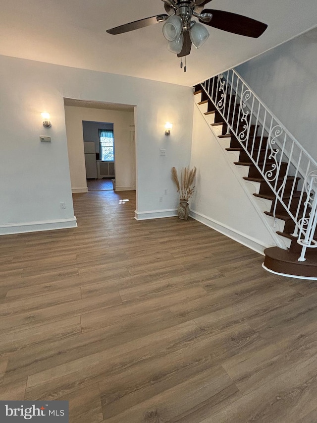 interior space with hardwood / wood-style flooring and ceiling fan