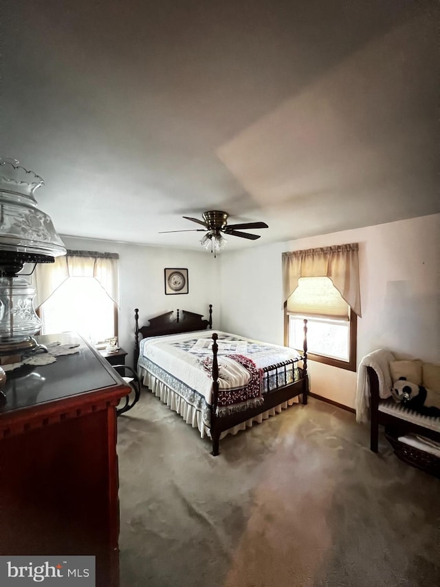 carpeted bedroom with ceiling fan