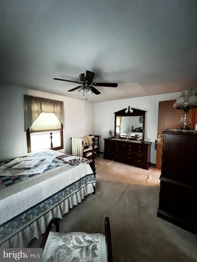 carpeted bedroom featuring ceiling fan