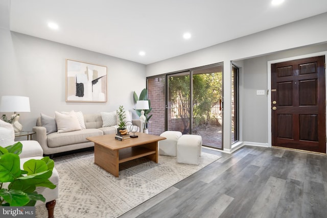 unfurnished living room with hardwood / wood-style flooring