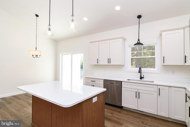 kitchen featuring sink, dishwasher, a kitchen island, white cabinetry, and dark wood-type flooring