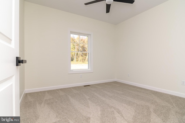 carpeted empty room with ceiling fan