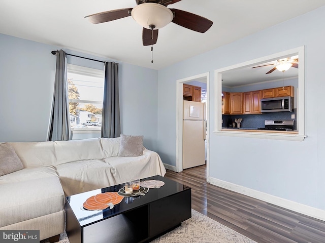 living room featuring light hardwood / wood-style flooring and ceiling fan