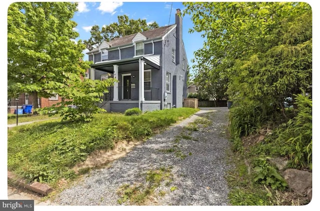 view of front of house with a sunroom