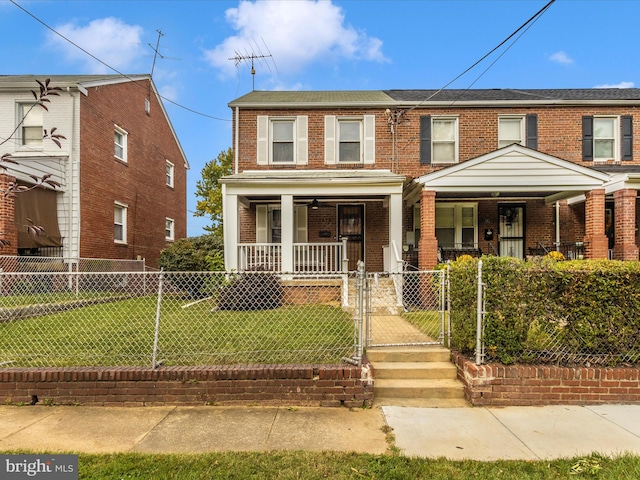 view of front of property featuring a front yard and a porch